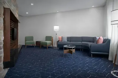 a living room with a couch and two chairs at Courtyard Philadelphia Great Valley/Malvern in Malvern