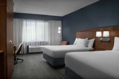 a hotel room with two beds and a window at Courtyard Philadelphia Great Valley/Malvern in Malvern
