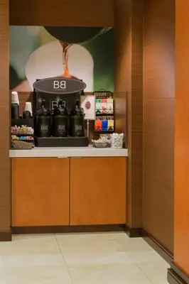 a counter with a coffee maker in a room at Fairfield Inn & Suites Kennett Square in Kennett Square