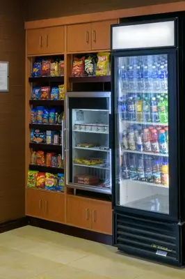 a refrigerator with its door open in a store at Fairfield Inn & Suites Kennett Square in Kennett Square