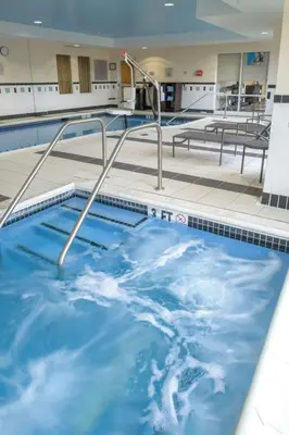 a large swimming pool with blue water at Fairfield Inn & Suites Kennett Square in Kennett Square