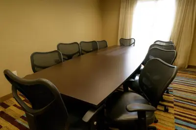 a conference room with a long table and chairs at Fairfield Inn & Suites Kennett Square in Kennett Square