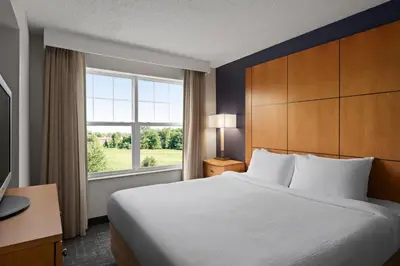 a hotel room with a bed and a window at Residence Inn Mt. Laurel at Bishop's Gate in Mount Laurel