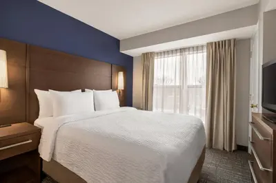 a hotel room with a large bed and a window at Residence Inn by Marriott Philadelphia West Chester/Exton in Exton