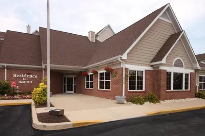 a red brick building with a sign on it at Residence Inn by Marriott Philadelphia West Chester/Exton in Exton