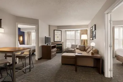 a hotel suite with a living room and a bedroom at Residence Inn by Marriott Philadelphia West Chester/Exton in Exton
