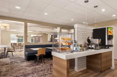 a restaurant with a counter with food on it at Residence Inn by Marriott Philadelphia West Chester/Exton in Exton