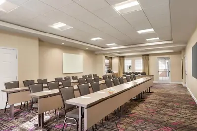 a conference room with rows of tables and chairs at Residence Inn by Marriott Philadelphia West Chester/Exton in Exton