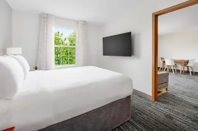 a hotel room with a bed and a television at TownePlace Suites Philadelphia Horsham in Horsham
