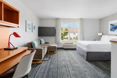 a hotel room with a bed and a couch at TownePlace Suites Philadelphia Horsham in Horsham
