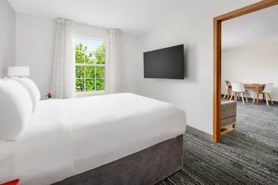 a hotel room with a bed and a television at TownePlace Suites Philadelphia Horsham in Horsham