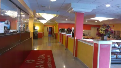 a fast food restaurant with a long line of counters at Ramada by Wyndham East Orange in East Orange