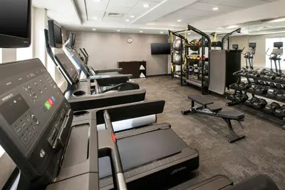 a gym with treadmills and machines in a room at Fairfield Inn & Suites by Marriott Somerset in Somerset