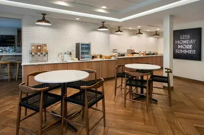 a restaurant with two tables and chairs and a counter at Fairfield Inn & Suites by Marriott Somerset in Somerset