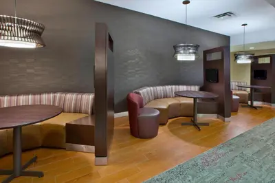 a waiting room with two tables and a couch at Courtyard by Marriott Somerset in Somerset