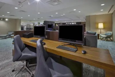 an office with two computer monitors on a desk at Courtyard by Marriott Somerset in Somerset