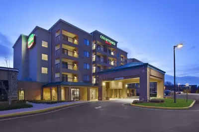 a hotel with a gas station in front of it at Courtyard by Marriott Somerset in Somerset