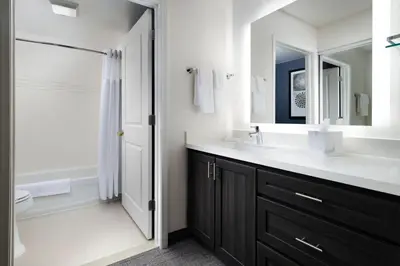 a bathroom with a sink and a shower at Residence Inn Mount Olive At International Trade Center in Stanhope