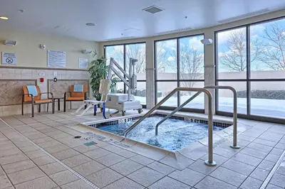 a swimming pool in a hospital room with a pool at Courtyard by Marriott Harrisburg West/Mechanicsburg in Mechanicsburg
