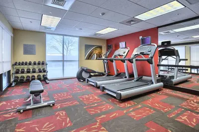 a gym with treadmills and cardio equipment in a building at Courtyard by Marriott Harrisburg West/Mechanicsburg in Mechanicsburg