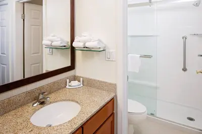 a bathroom with a sink and a shower and a toilet at Residence Inn Cherry Hill Philadelphia in Cherry Hill