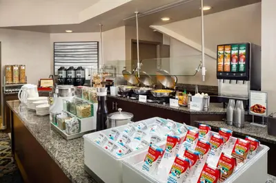 a kitchen with a counter with food items on it at Residence Inn Cherry Hill Philadelphia in Cherry Hill
