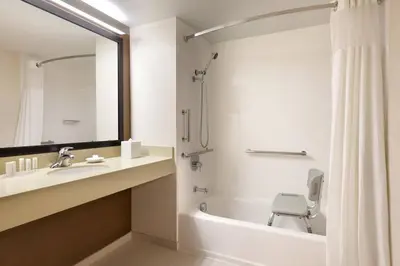 a bathroom with a tub and a sink and a toilet at Fairfield Inn Philadelphia Valley Forge/King of Prussia in King of Prussia