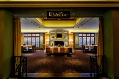 a dining room with tables and a sign that reads rutherford room at Hilton Garden Inn New York/Staten Island in Staten Island