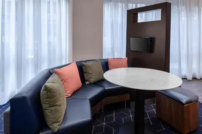 a living room with a couch and a table at Courtyard Reading Wyomissing in Reading