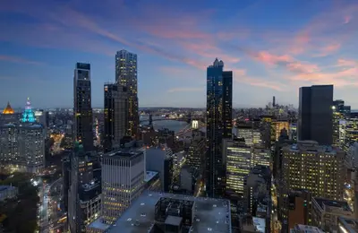 a view of a city skyline at night at M Social Hotel New York Downtown in New York