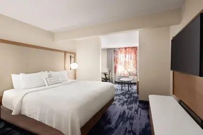 a hotel room with a bed and a television at Fairfield Inn by Marriott Scranton in Scranton