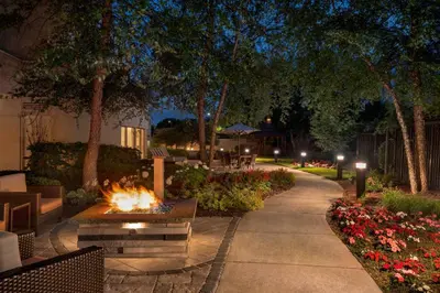 a fire pit in a park at night at Courtyard by Marriott Middletown Goshen in Middletown