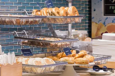 a display of breads and pastries in a bakery at SpringHill Suites Quakertown Pennsylvania in Quakertown