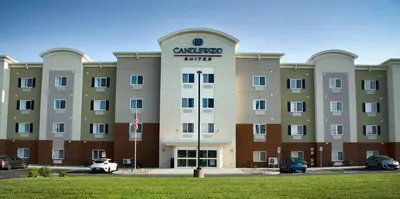 a large building with a sign on the front of it at Candlewood Suites - Lancaster West by IHG in Lancaster
