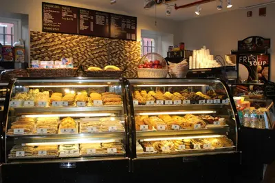 a bakery display case filled with lots of pastries at HI New York City Hostel in New York