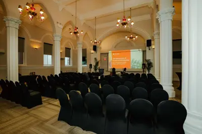 a large room with chairs and a screen in it at HI New York City Hostel in New York