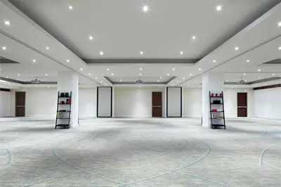 an empty room with a large room with white walls at Hyatt Centric Wall Street New York in New York