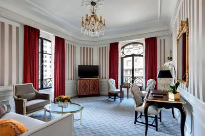 a living room with a couch and a tv at The St. Regis New York in New York