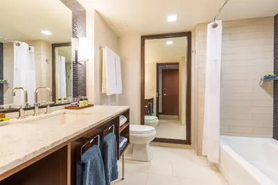 a bathroom with a tub and a toilet and a sink at InterContinental New York Times Square by IHG in New York