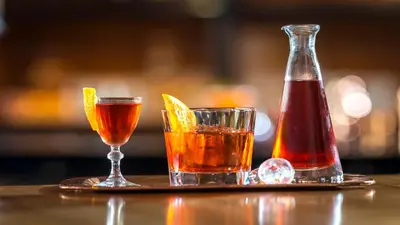 a tray with two drinks and a bottle of ketchup at InterContinental New York Times Square by IHG in New York