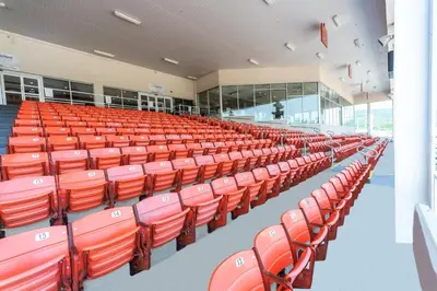 an empty lecture hall with red chairs in it at Tioga Downs Casino and Resort in Nichols