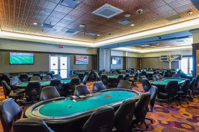 a conference room with poker tables and chairs at Tioga Downs Casino and Resort in Nichols