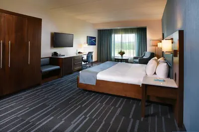 a hotel room with a bed and a television at Tioga Downs Casino and Resort in Nichols