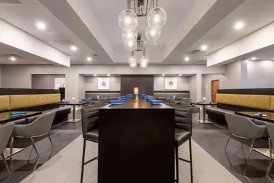 a conference room with a long table and chairs at Wyndham Lancaster Resort and Convention Center in Lancaster