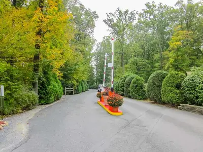 a park with a row of benches and trees at Appalachian Camping Resort Park Model 2 in Shartlesville