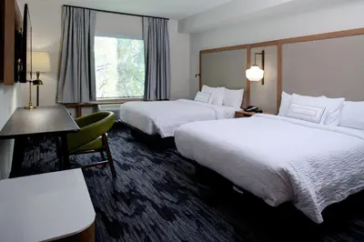 a hotel room with two beds and a window at Fairfield Inn & Suites by Marriott Allentown West in Breinigsville