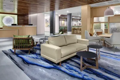 a living room with a couch and a table at Fairfield Inn & Suites by Marriott Allentown West in Breinigsville