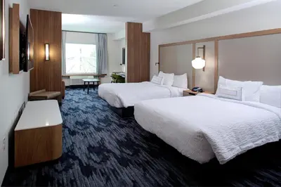 a hotel room with two beds and a window at Fairfield Inn & Suites by Marriott Allentown West in Breinigsville
