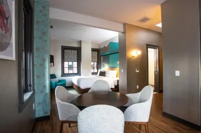 a hotel room with a bed and a table and chairs at Fairfield Inn & Suites by Marriott Philadelphia Downtown/Center City in Philadelphia