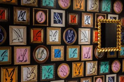 a wall filled with different colored frames of clocks at Fairfield Inn & Suites by Marriott Philadelphia Downtown/Center City in Philadelphia